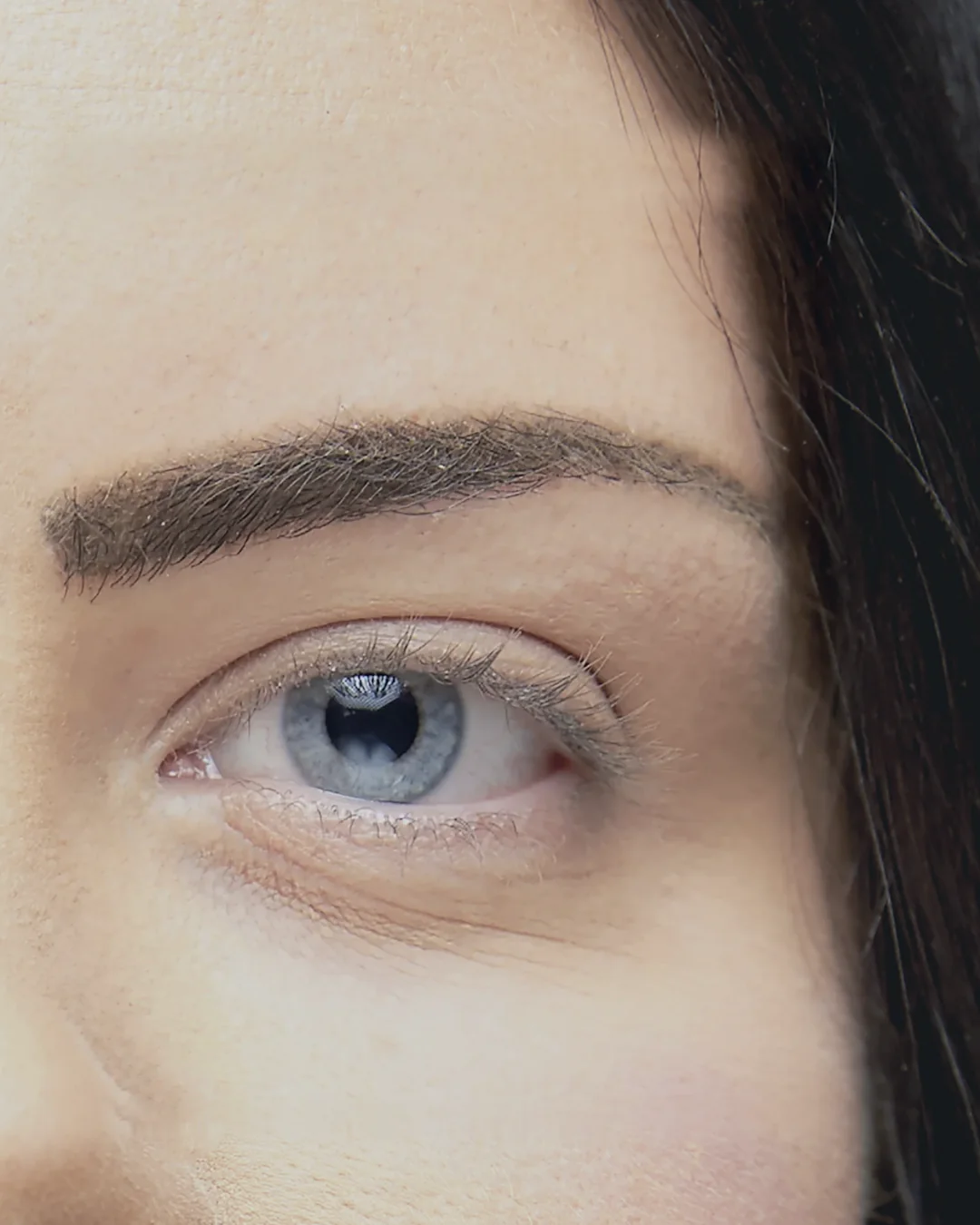 Model&rsquo;s eye with natural lashes, before extensions